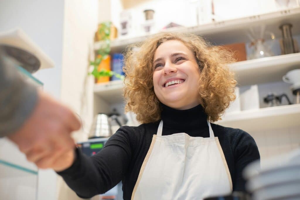 Happy shop owner